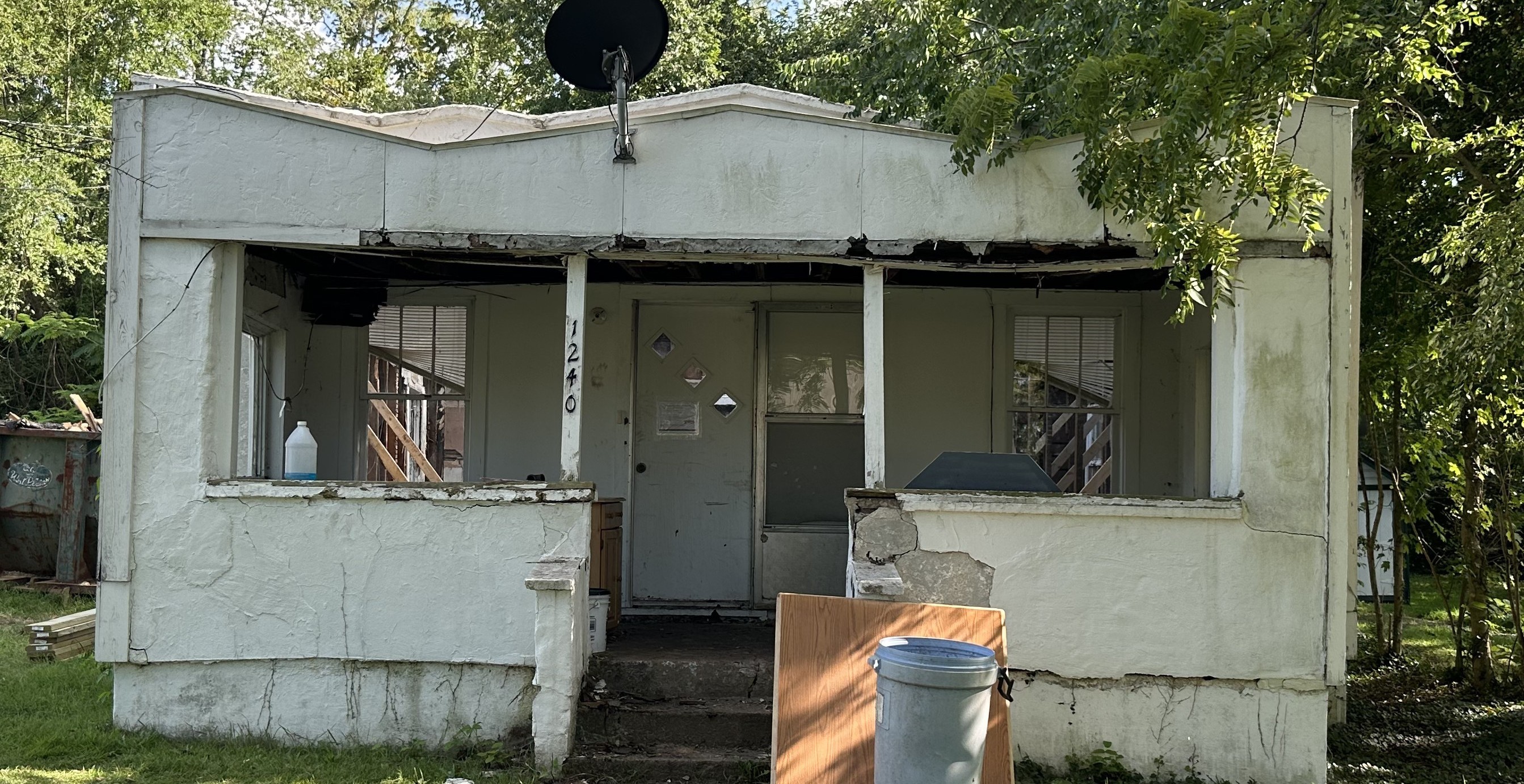 Marion Ohio home exterior before restoration &mdash; exposed framing and site work